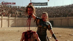 Female Gladiator Holds Severed Head