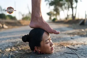 Foot on Head in Dirt