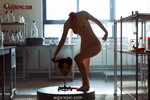 Nude Woman Holds Severed Head