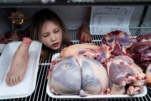 Child in Meat Display