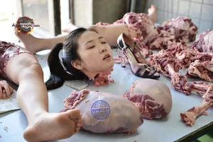 Woman Amidst Raw Meat