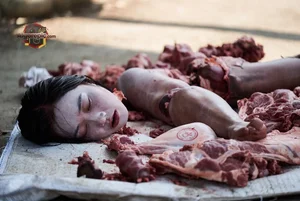 Woman Amidst Raw Meat