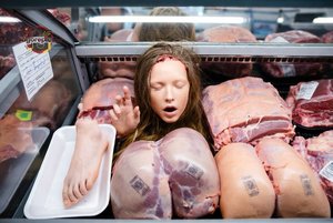 Woman in Meat Display