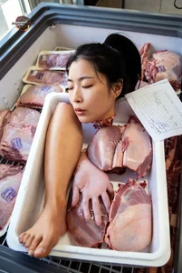 Woman in Meat Display