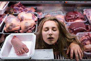 Woman in Meat Display