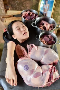 Woman with Butcher Meat