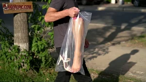 Man Carrying Bagged Leg