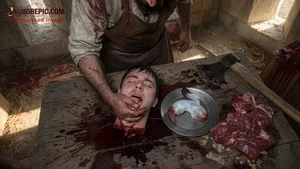 Bloody Butcher Holding Severed Head