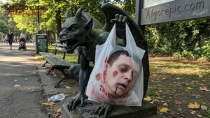 Gargoyle Holding Bloody Head Bag