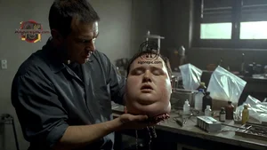 Man Holding Severed Head