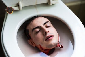 Man in Toilet with Blood