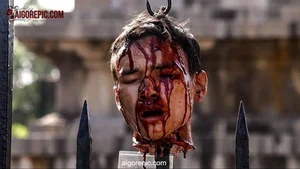 Severed Head on Fence