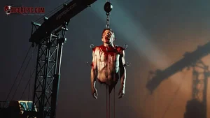 Bloody Man Hanged by Crane