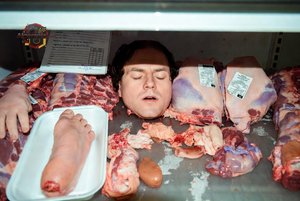 Man in Meat Display
