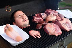 Man on Grill with Meats