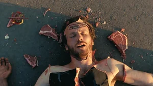 Man with Meat on Ground