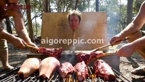 Men Grilling Severed Head