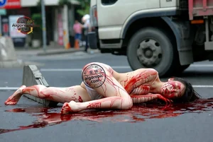 Woman in Bloody Street Scene