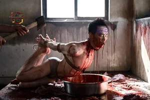 Bound Man in Blood Bath