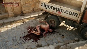 Gory Dismembered Man by Truck