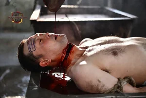 Man in Blood-Filled Trough